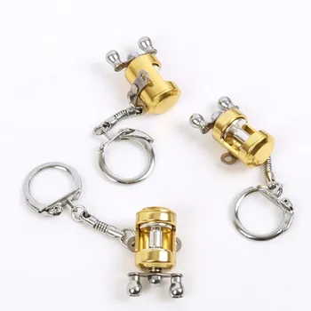 1 vnt Kūrybos Aukso Spalvos Skristi Ritės Key Chain Velkamosiomis Ritės Modelis Žvejybos Metalo Keychain Withe Mažas Pakabukas Žvejybos Mėgėjas